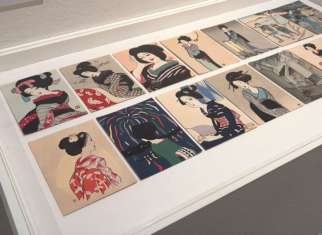 Display of postcards featuring Yumeji's wistful female portraits